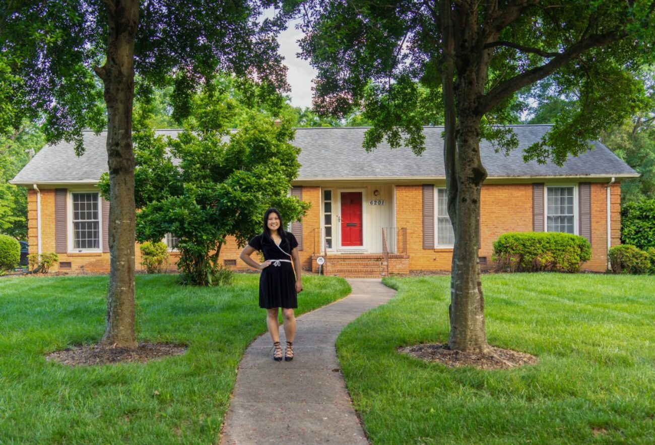 Entrepreneur Bernadette Joy Maulion standing in front of her home