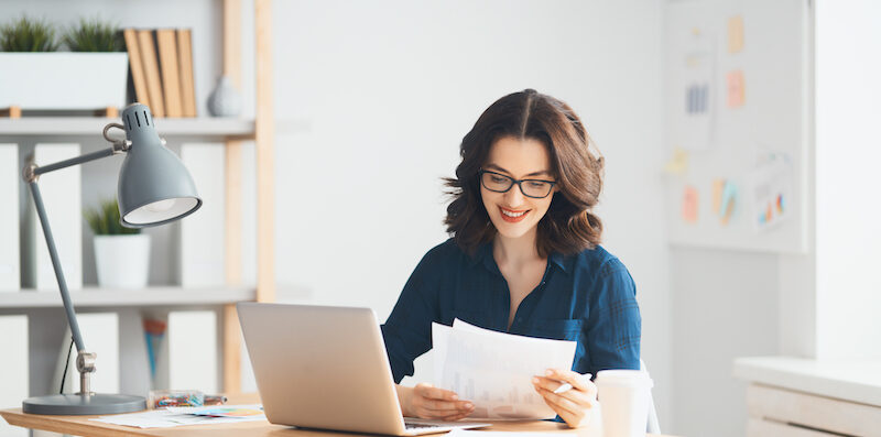 Woman using computer to research what is a personal loan?