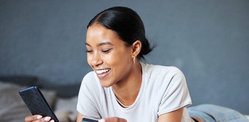 Young woman asking "Are credit cards good or bad?"