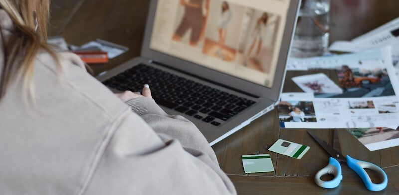 Person online shopping with alternatives to credit cards after cutting up their credit cards.