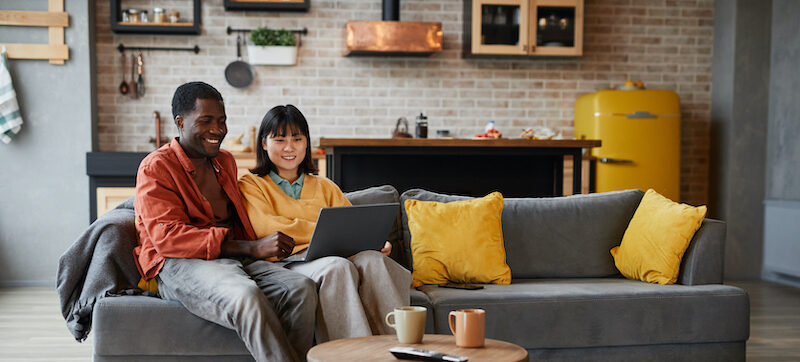 Couple reading a Hometap review about accessing home equity.