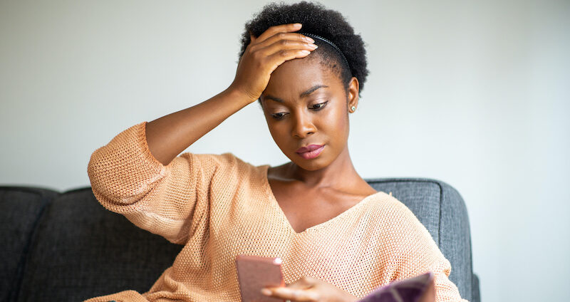 A young woman looks concerned after saying, "A Random Person Sent Me Money on Cash App!"