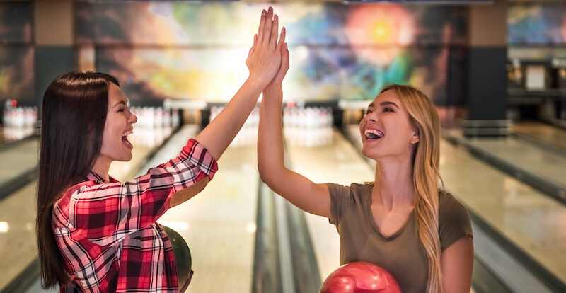 Two young women who found bowling apps that are just as fun as playing in real life.