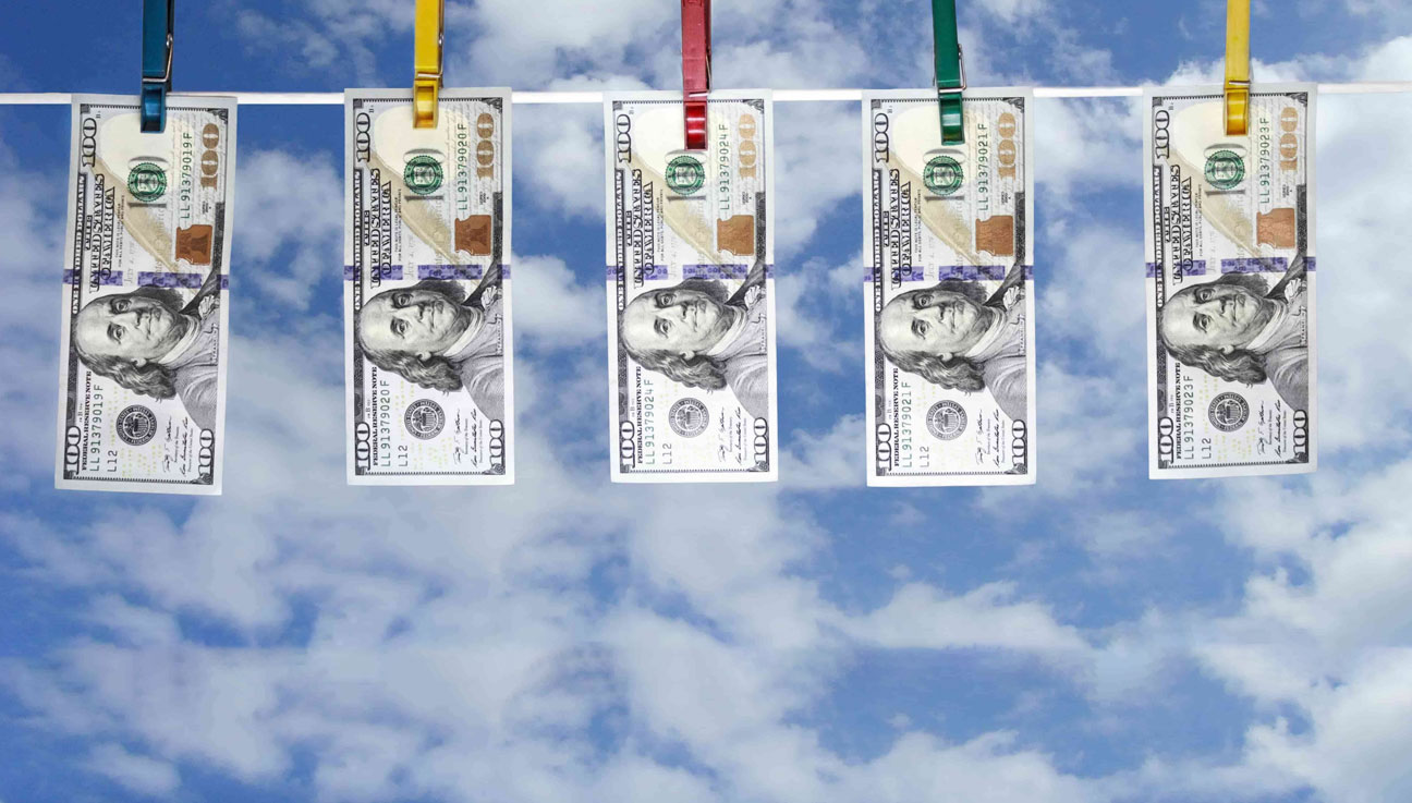 100 dollars bills on a clothesline