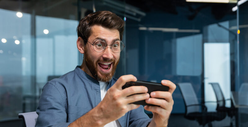 A man excited about winning a$10 Google Play gift card free.